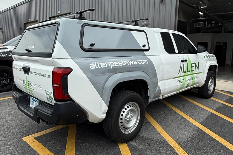Fleet graphics with gray stripe on side of work truck.