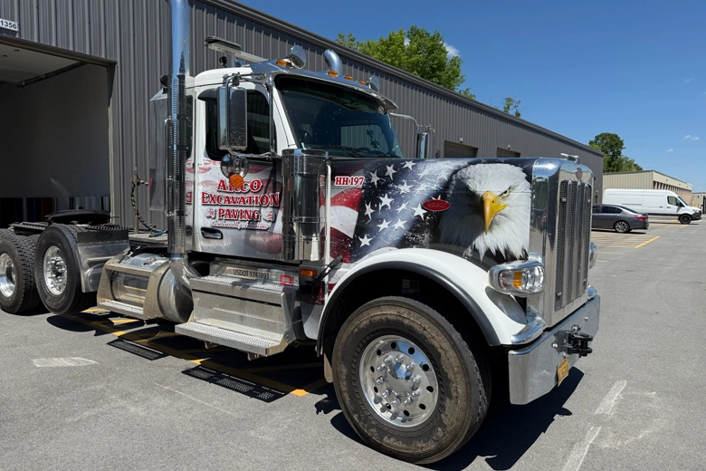 Peterbilt truck with custom usa flag design.