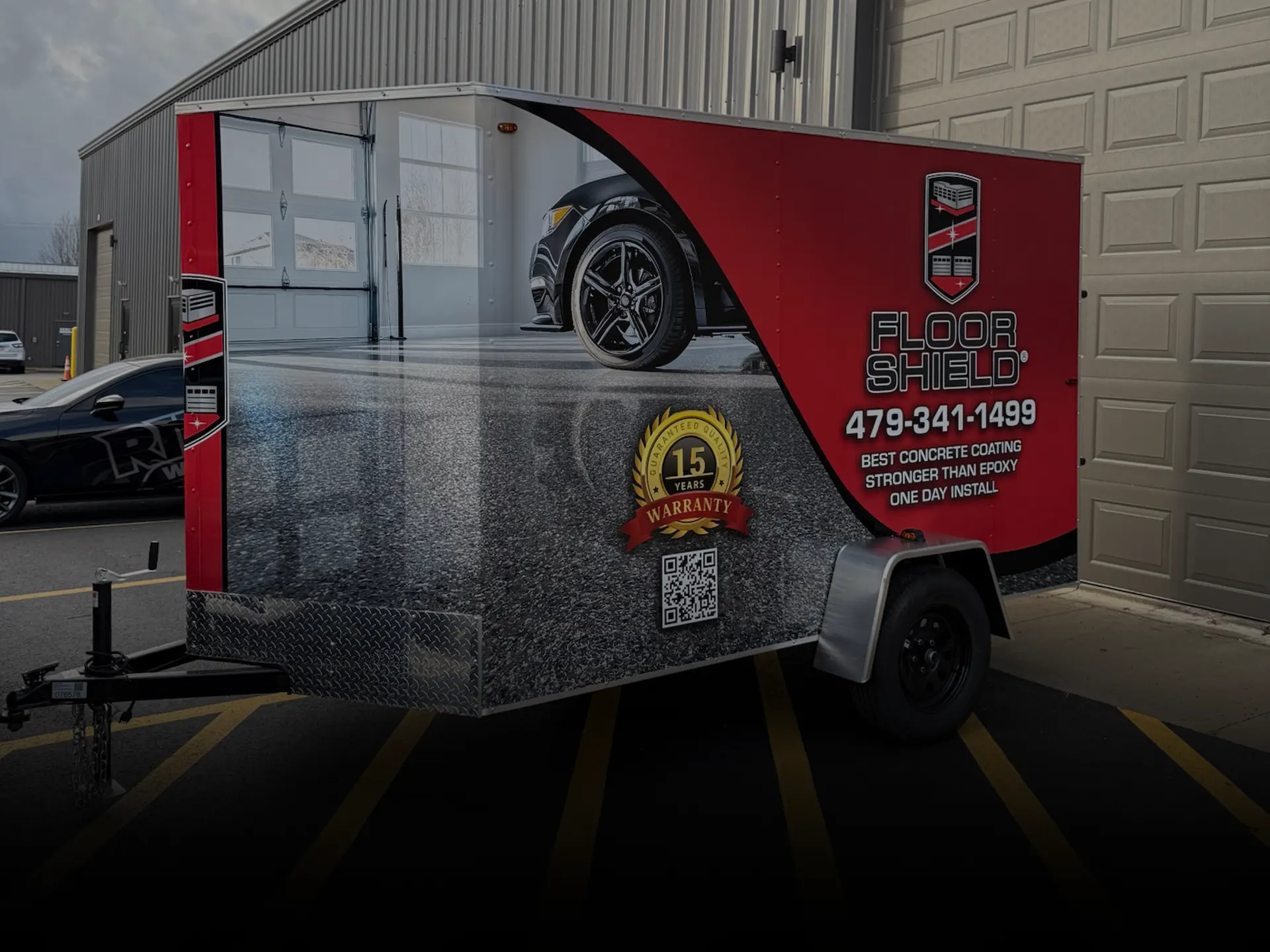 Box trailer fully vinyl wrapped with business graphics.