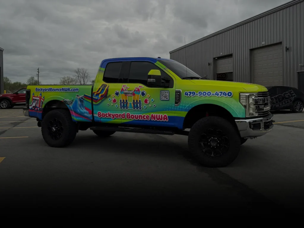 Wrapped F250 with bright color commercial wrap.