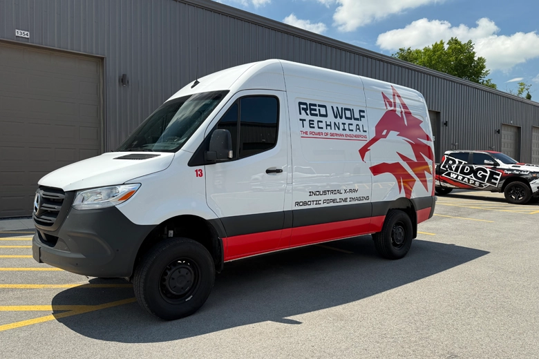 Business fleet graphics installed on sides of sprinter work van.