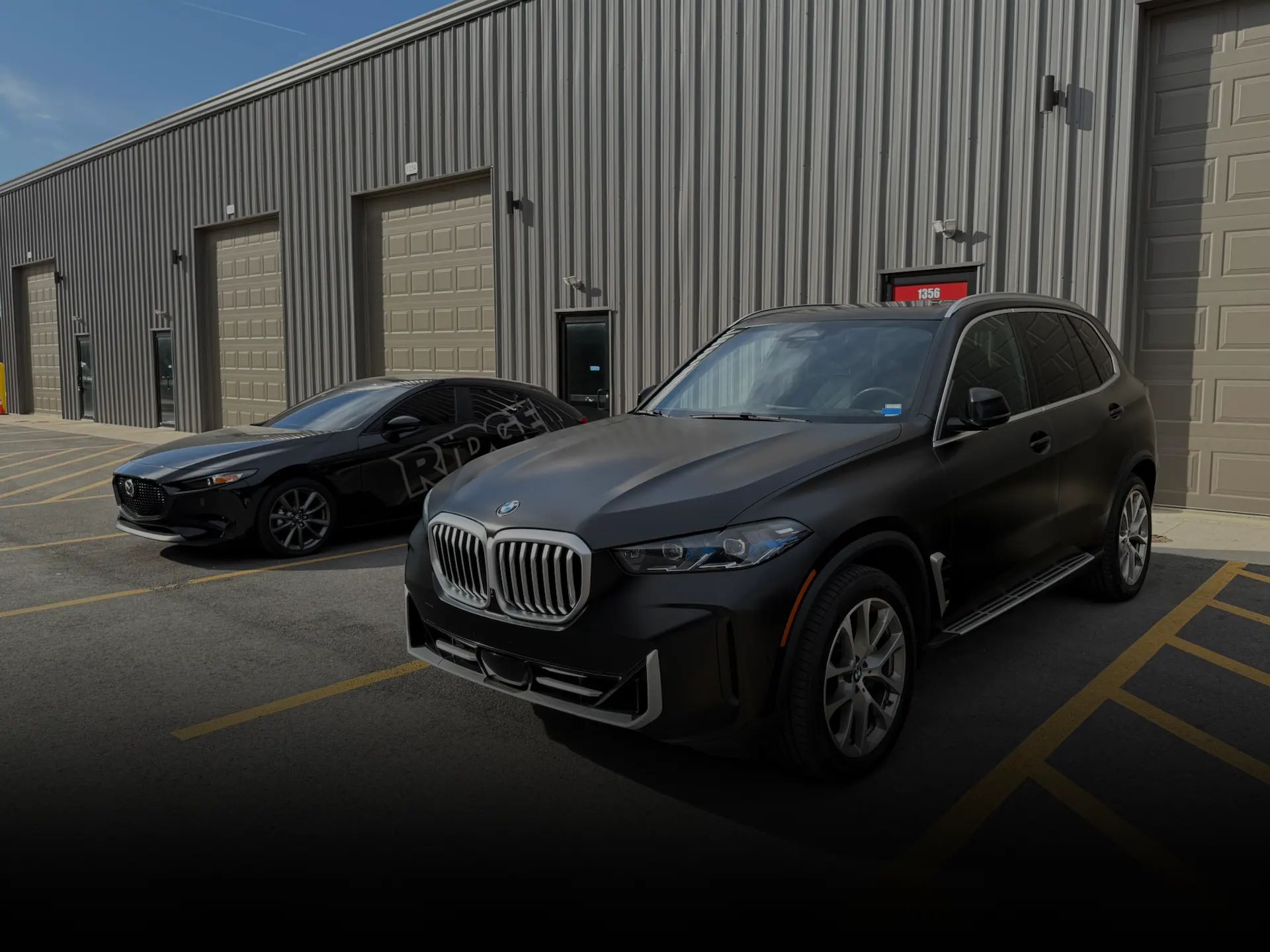 Professionally vinyl wrapped satin black SUV.